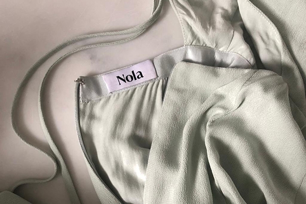 10 Questions for Nola London Co Founders Abigail Heinimann and Sophia Munro Sustainable Bridesmaid dress Sage Green